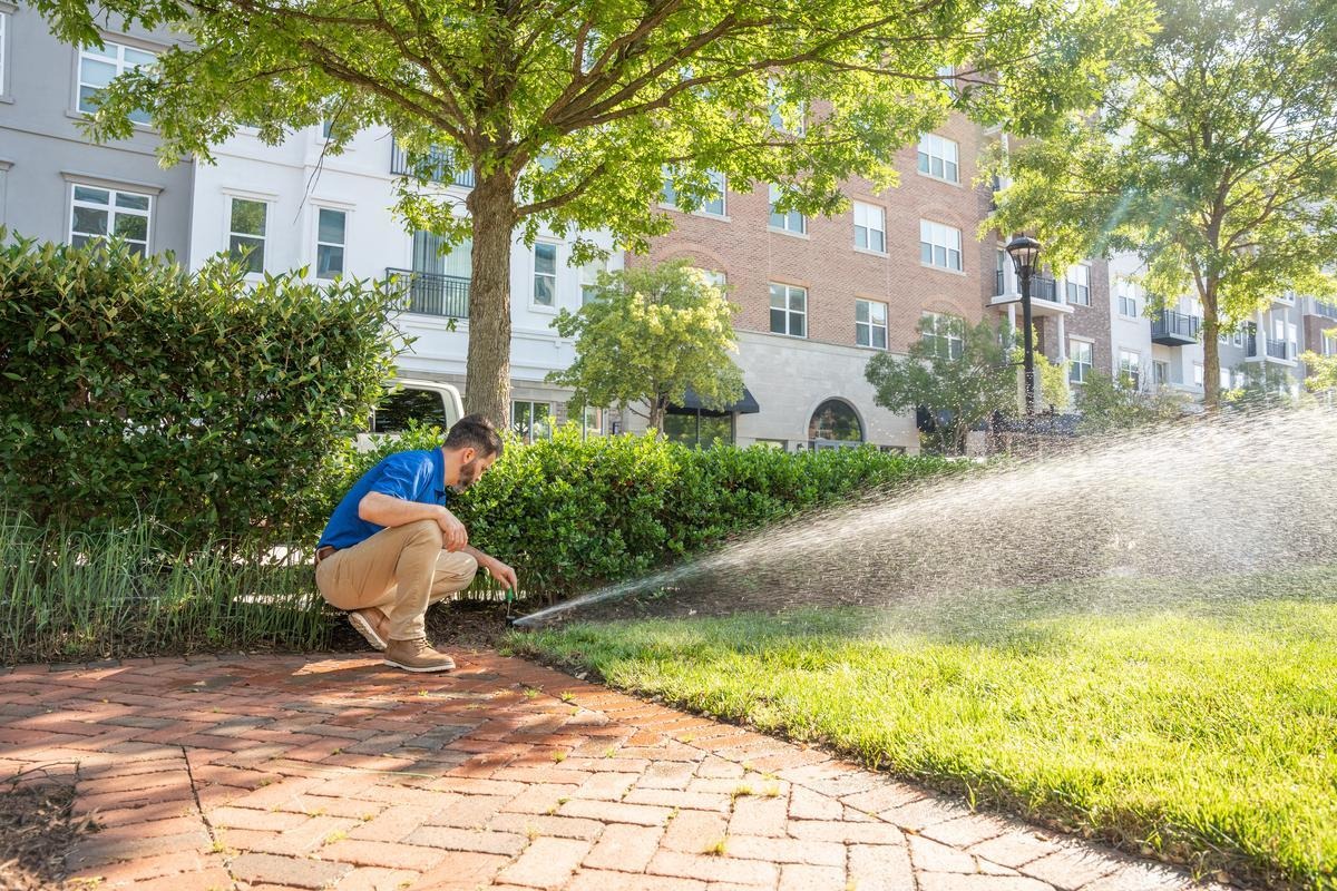 man installing sprinkler
