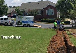 Trenching - Conserva specialists digging a trench