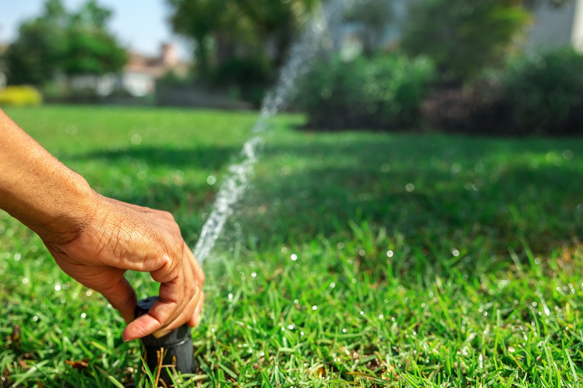 grand-rapids-sprinkler-repair-technician-fixing-sprinkler-head