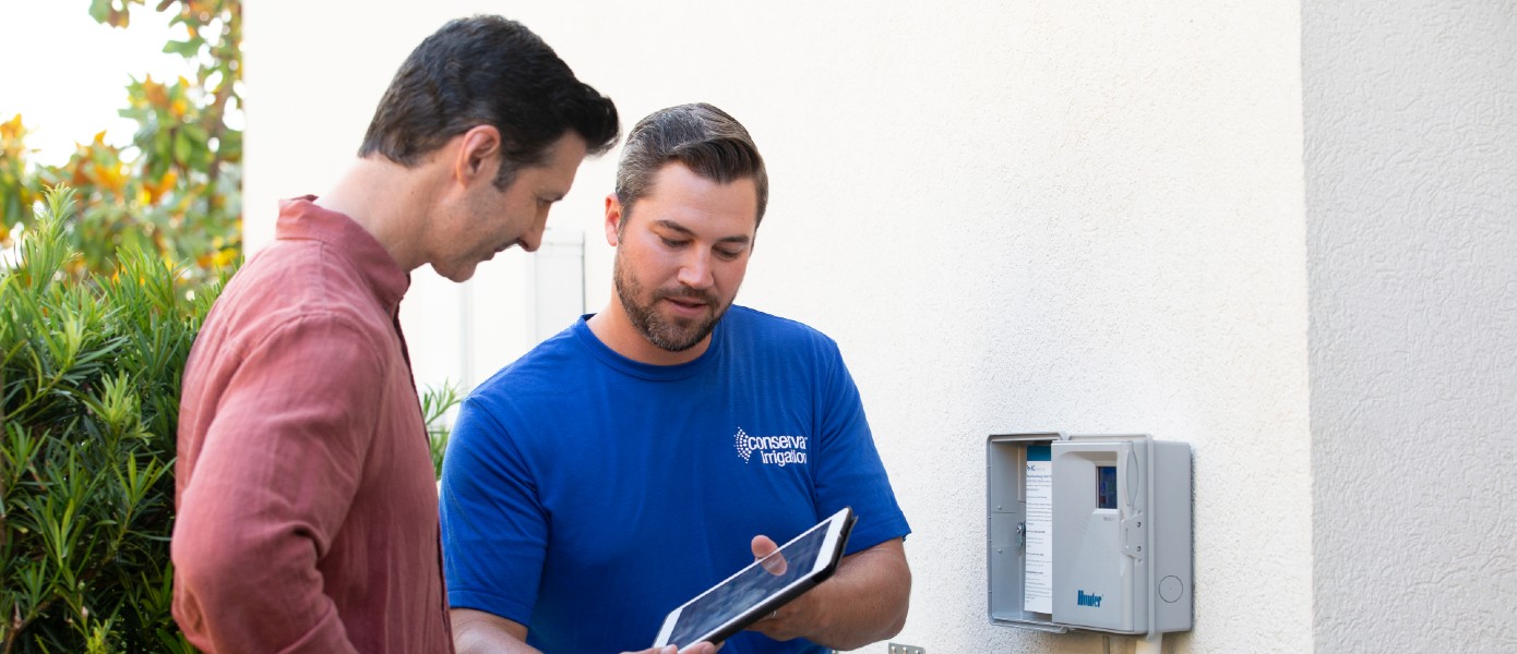 two men reviewing smart irrigation system aop