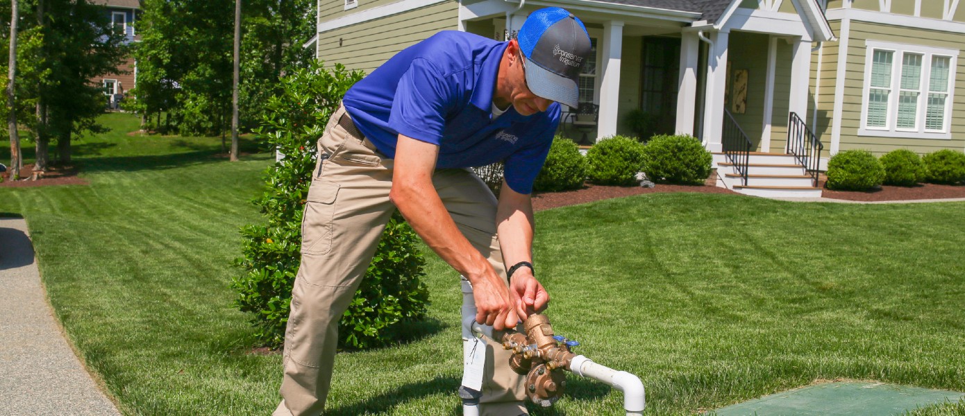 man doing maintenance on sprinkler system 