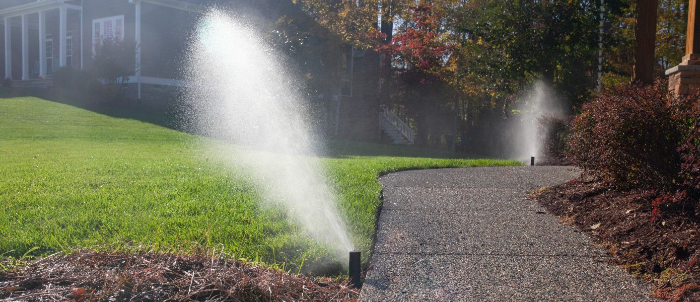 two sprinklers in yard