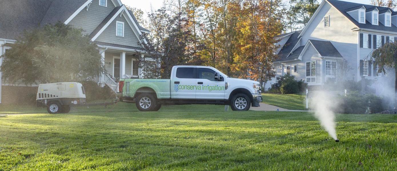 conserva irrigation truck in a front yard