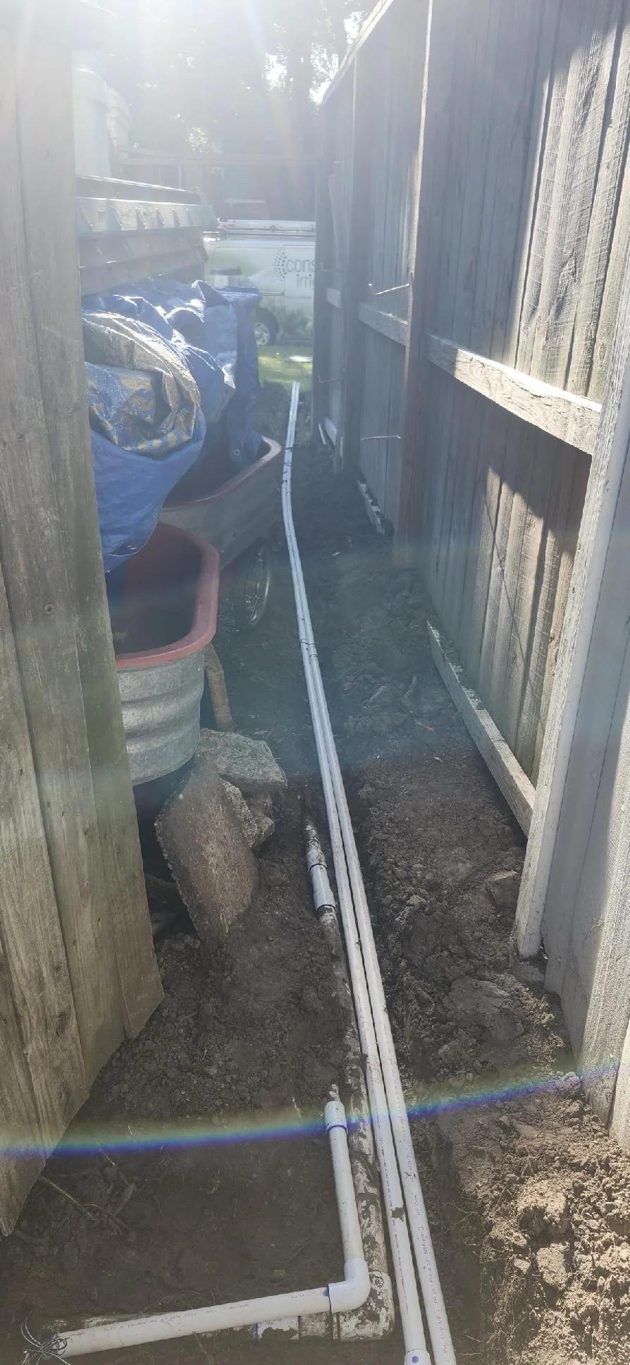 New irrigation piping installed along side yard